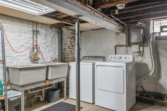 clothes washing area with washer and dryer