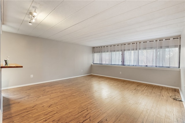 spare room featuring hardwood / wood-style floors