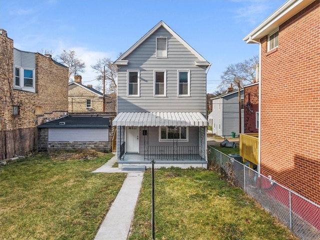 back of house featuring a porch and a yard