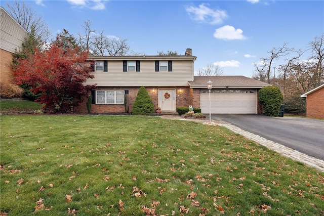 view of front property with a garage and a front lawn