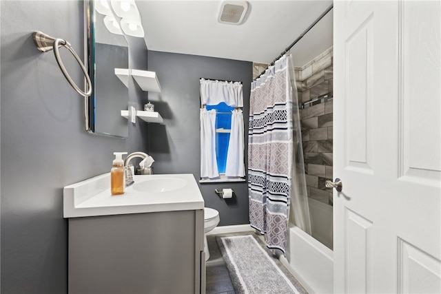 full bathroom with vanity, toilet, and shower / bath combo with shower curtain