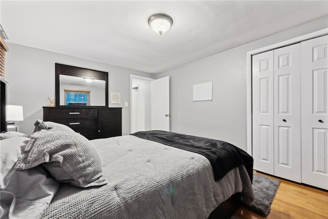 bedroom featuring hardwood / wood-style flooring and a closet