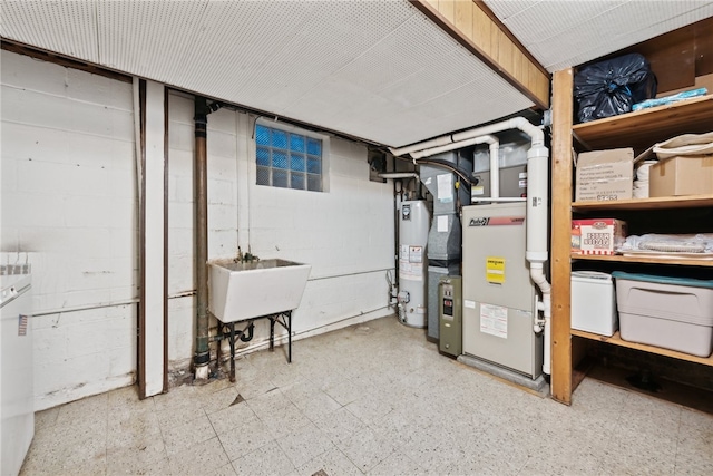 basement featuring gas water heater and sink