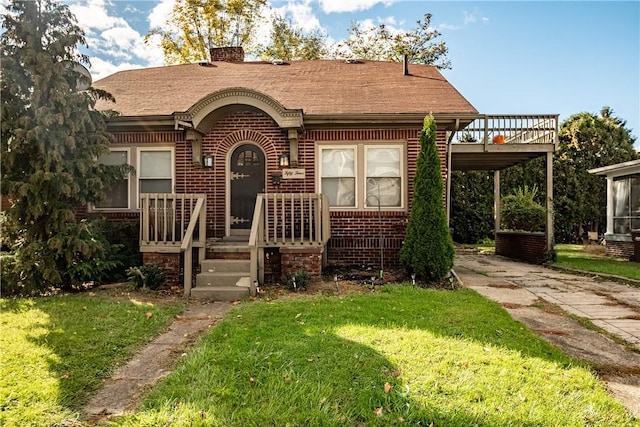 54 Buhl Ct, Sharon, PA 16146 - view of front of home featuring concrete driveway, brick siding, a wooden deck, a front yard, and a chimney
