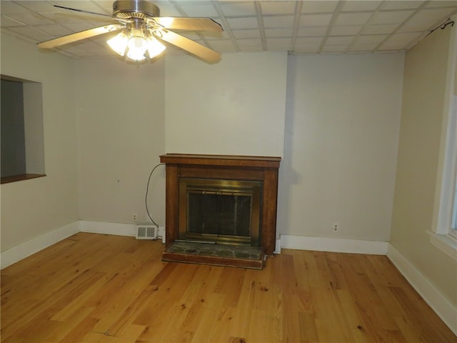 interior details featuring ceiling fan and wood-type flooring