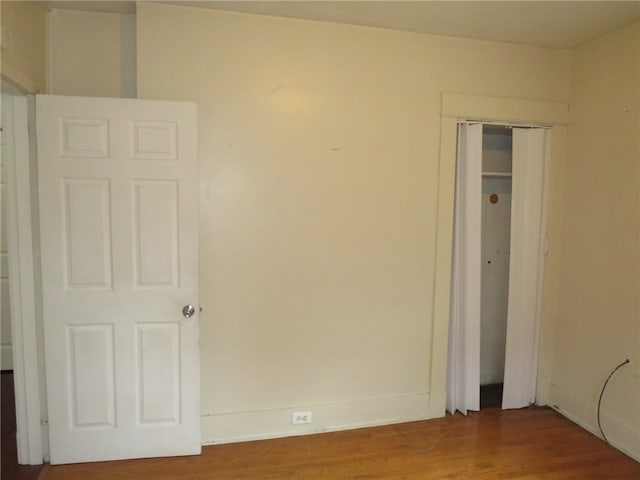 spare room featuring hardwood / wood-style flooring