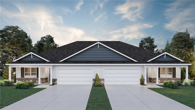 view of front of home featuring a garage and a front yard