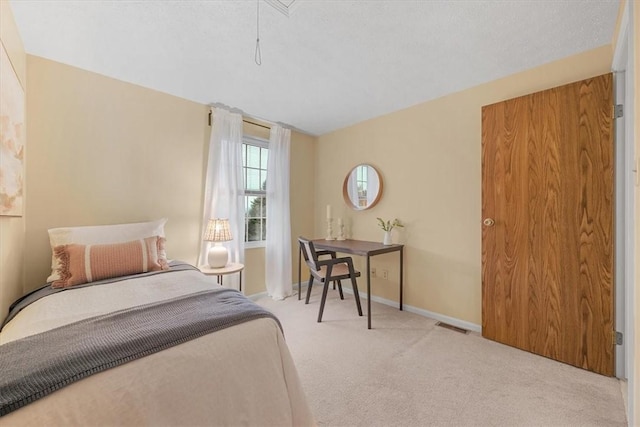 bedroom featuring light colored carpet