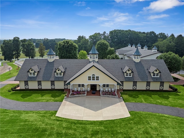 view of front of home featuring a porch and a front lawn