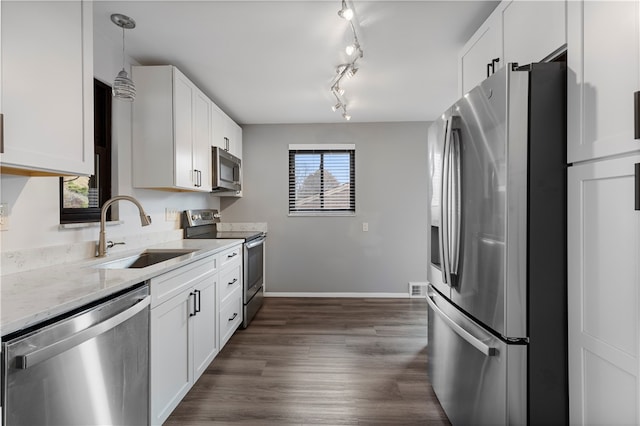 kitchen with white cabinetry, sink, dark hardwood / wood-style floors, and appliances with stainless steel finishes