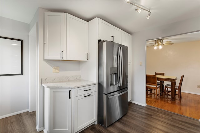 kitchen with white cabinets, stainless steel fridge, and dark hardwood / wood-style flooring