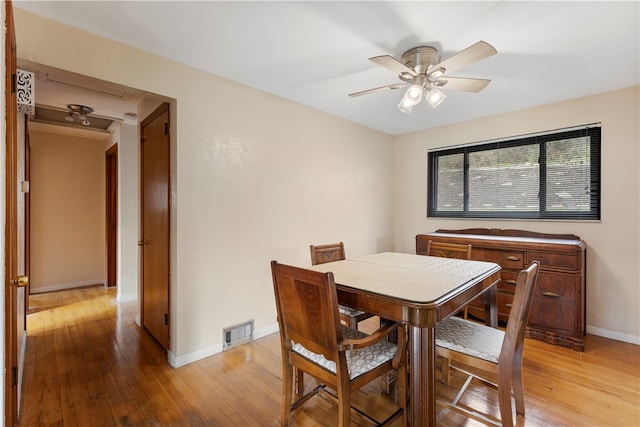 dining space featuring ceiling fan and light wood-type flooring