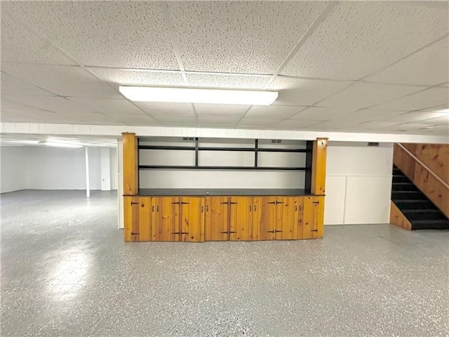 basement featuring a paneled ceiling