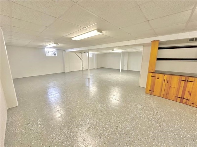 basement featuring a drop ceiling