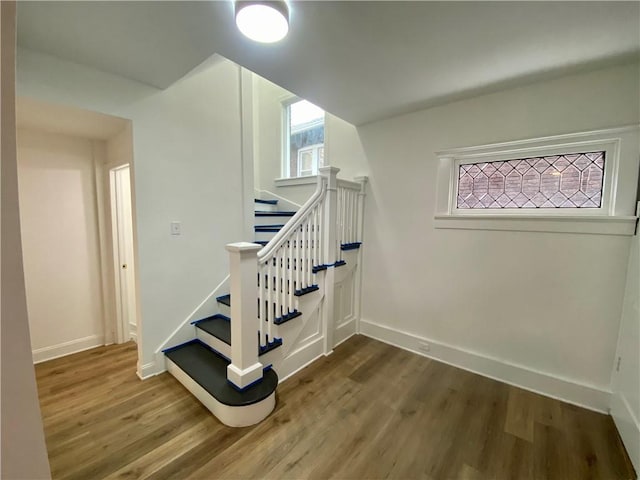 stairs with wood-type flooring