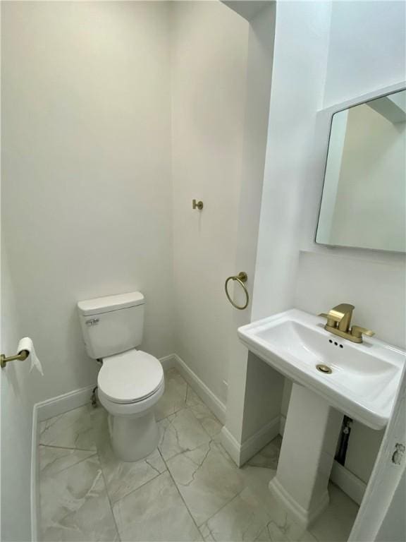 bathroom featuring toilet