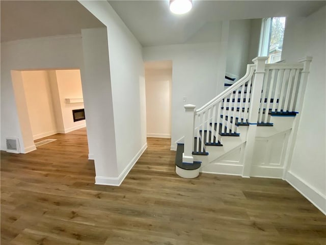 stairway featuring hardwood / wood-style floors