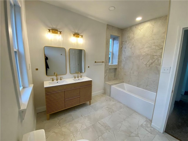 bathroom with vanity and a tub to relax in