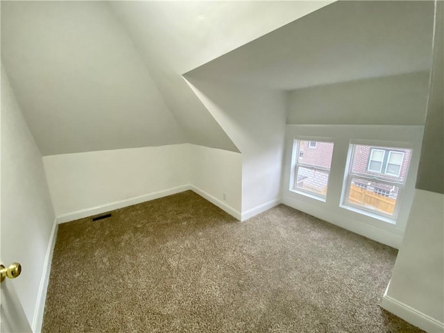 bonus room featuring carpet and vaulted ceiling