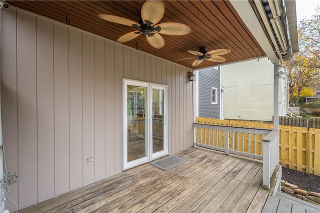 wooden deck featuring ceiling fan