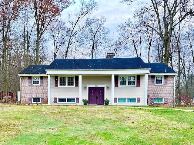 raised ranch featuring a front yard