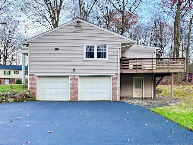 view of front facade featuring a deck and a garage