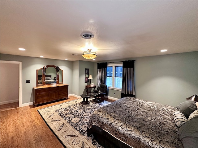 bedroom with light wood-type flooring