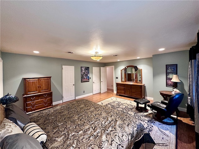 bedroom with light hardwood / wood-style flooring