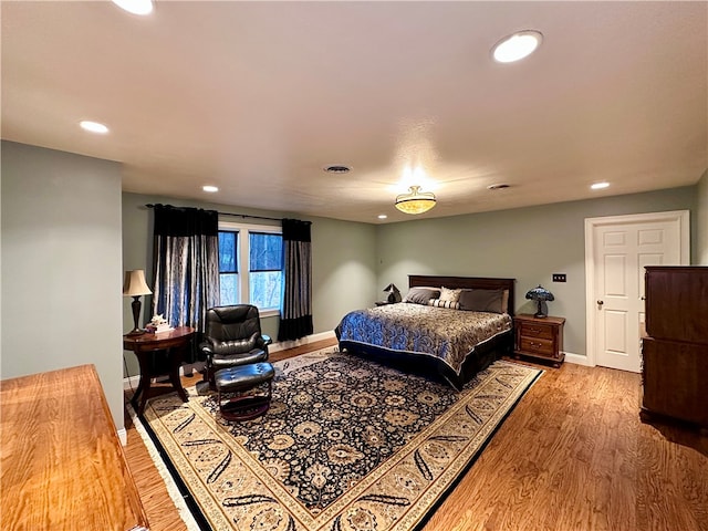 bedroom with wood-type flooring