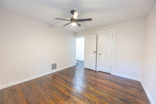 unfurnished bedroom featuring ceiling fan and dark hardwood / wood-style floors