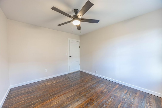 spare room with ceiling fan and dark hardwood / wood-style flooring