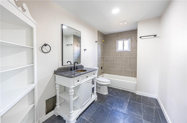 full bathroom with toilet, tiled shower / bath, and sink