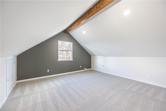 bonus room with carpet flooring and lofted ceiling with beams