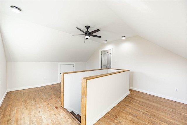 bonus room with light hardwood / wood-style flooring, ceiling fan, and lofted ceiling