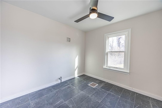 spare room with ceiling fan