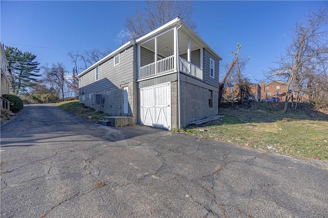 view of side of home with a balcony