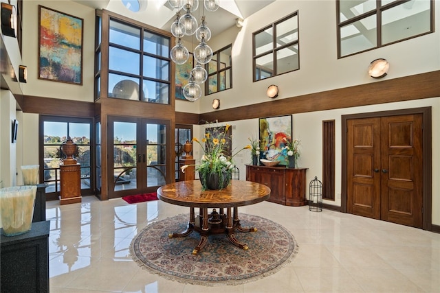 514 Justabout Rd, Peters Twp, PA 15367 - foyer entrance with french doors, a high ceiling, plenty of natural light, and baseboards