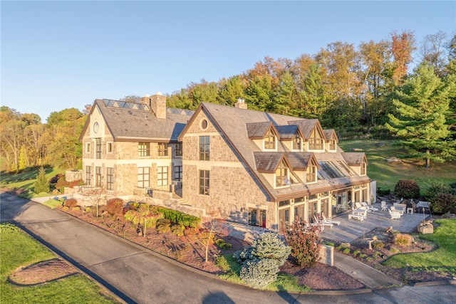 514 Justabout Rd, Peters Twp, PA 15367 - view of home's exterior with stone siding and a chimney