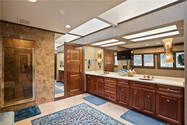 bathroom with vanity, ornamental molding, and walk in shower