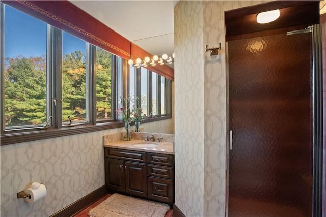 514 Justabout Rd, Peters Twp, PA 15367 - full bathroom with wallpapered walls, healthy amount of natural light, vanity, a shower with shower door, and wood finished floors