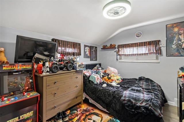 bedroom featuring wood-type flooring and lofted ceiling