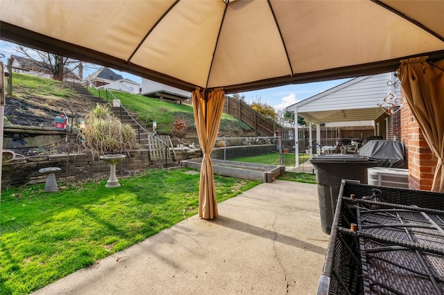 view of patio / terrace with a gazebo and central air condition unit