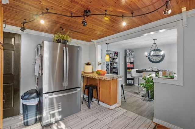 kitchen featuring stainless steel refrigerator, light stone countertops, wooden ceiling, a notable chandelier, and light wood-type flooring