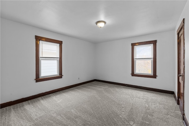 spare room with carpet flooring and a healthy amount of sunlight