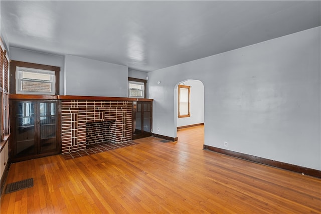 unfurnished living room with hardwood / wood-style flooring