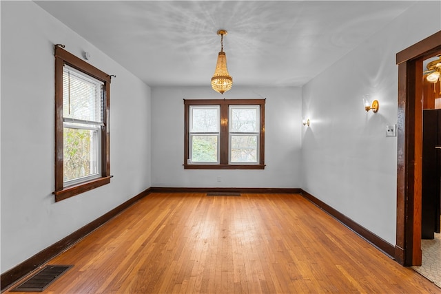 unfurnished room with light hardwood / wood-style flooring