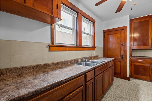 kitchen with ceiling fan, sink, and light tile patterned floors