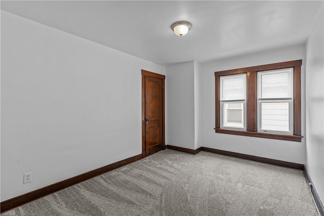 unfurnished room with carpet flooring