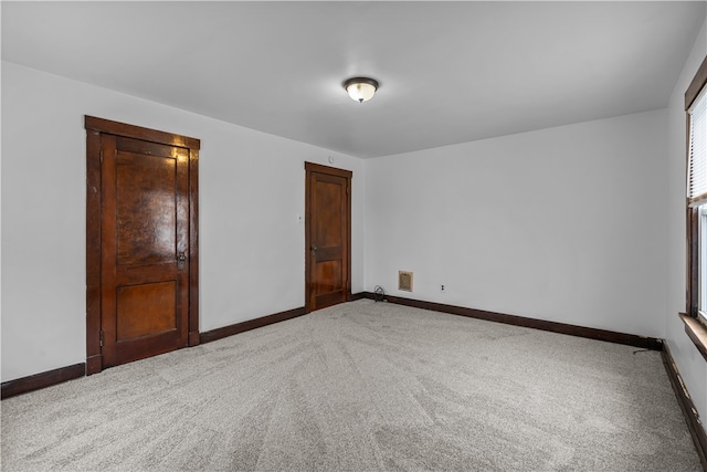 unfurnished bedroom with carpet