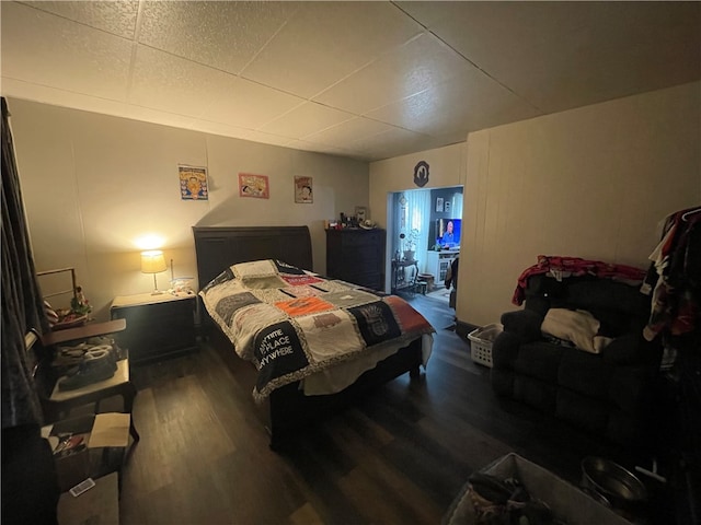 bedroom featuring dark wood-type flooring